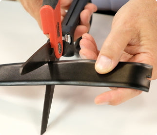 Trimming a SureFit Belt with scissors to fit.